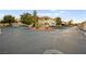 Exterior view of complex with covered parking, and mature landscaping on a sunny day at 354 Sunward Dr # 0, Henderson, NV 89014