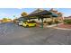 Assigned covered parking area with mature landscaping surrounding residential buildings at 354 Sunward Dr # 0, Henderson, NV 89014