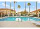 Community pool surrounded by lush landscaping and palm trees, perfect for relaxation at 354 Sunward Dr # 0, Henderson, NV 89014