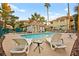 Community pool with lounge chairs surrounded by well-maintained landscaping and building exteriors at 354 Sunward Dr # 0, Henderson, NV 89014