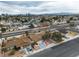 A high angle view of a single-Gathering home featuring desert landscaping, mature trees, and a paved driveway at 3572 Tempe St, Las Vegas, NV 89103