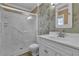 Bathroom featuring a single sink vanity with a shower behind a sliding glass door at 3572 Tempe St, Las Vegas, NV 89103