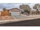 Lovely one-story home with a spacious two-car garage and a quaint white picket fence enhancing its charm at 3572 Tempe St, Las Vegas, NV 89103