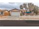 Charming single-story home featuring a two-car garage and a cute white picket fence at 3572 Tempe St, Las Vegas, NV 89103