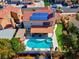 Stunning overhead view of home highlighting solar panels, backyard pool and patio at 37 Stone Cress Dr, Henderson, NV 89074