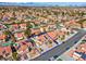 Real estate neighborhood view with red tile roofs, solar panels, well-maintained yards, and blue outline for lot boundaries at 37 Stone Cress Dr, Henderson, NV 89074