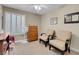 Bright bedroom offering comfortable seating, a ceiling fan, and ample natural light at 37 Stone Cress Dr, Henderson, NV 89074