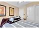 Comfortable bedroom featuring stylish decor and a cozy, striped comforter on the bed at 37 Stone Cress Dr, Henderson, NV 89074