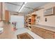 An updated garage with storage cabinets and overhead lighting at 37 Stone Cress Dr, Henderson, NV 89074