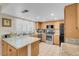 Bright kitchen with granite counters, stainless appliances, and light wood cabinetry at 37 Stone Cress Dr, Henderson, NV 89074
