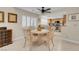 Open floor plan with dining area looking into kitchen with stainless steel appliances at 37 Stone Cress Dr, Henderson, NV 89074