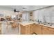 Cozy kitchen featuring wood cabinets and granite countertops with backyard views at 37 Stone Cress Dr, Henderson, NV 89074