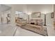 Bright living room with neutral tones, elegant furniture, tile flooring, and an inviting open layout at 37 Stone Cress Dr, Henderson, NV 89074