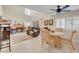 Open concept living space with fireplace, dining area, and vaulted ceilings at 37 Stone Cress Dr, Henderson, NV 89074