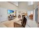 Bright living room with fireplace and loft, featuring comfortable seating and neutral decor at 37 Stone Cress Dr, Henderson, NV 89074