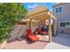 Relaxing outdoor patio with lounge chairs and grill, perfect for enjoying the sunshine and outdoor cooking at 37 Stone Cress Dr, Henderson, NV 89074