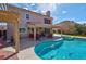 Beautiful pool and covered patio area perfect for entertaining guests or enjoying a peaceful evening outdoors at 37 Stone Cress Dr, Henderson, NV 89074