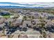 A high angle shows this single-story home in a community with a pond and mountain views at 4087 Villa Rafael Dr, Las Vegas, NV 89141
