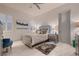 Comfortable bedroom featuring a queen bed, modern decor, LED headboard, and marble tile flooring at 4087 Villa Rafael Dr, Las Vegas, NV 89141