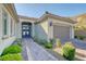Inviting home exterior with manicured landscaping, paver driveway, and a well-lit, double-door entryway at 4087 Villa Rafael Dr, Las Vegas, NV 89141