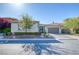 Charming single-story home with well-maintained landscaping, a paver driveway, and an attached garage at 4087 Villa Rafael Dr, Las Vegas, NV 89141