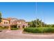 Elegant stone exterior with manicured landscaping and a circular driveway at 4087 Villa Rafael Dr, Las Vegas, NV 89141