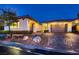 Inviting single-story home with meticulously maintained landscaping and a paver driveway at 4087 Villa Rafael Dr, Las Vegas, NV 89141