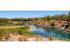 Scenic golf course view featuring a tranquil lake, lush green fairways, and mature trees at 4087 Villa Rafael Dr, Las Vegas, NV 89141