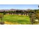 Expansive community greenspace with mature trees and mountain views at 4087 Villa Rafael Dr, Las Vegas, NV 89141
