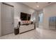 Hallway features modern console table, large television, and neutral color scheme at 4087 Villa Rafael Dr, Las Vegas, NV 89141