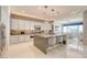 A spacious kitchen showcasing modern cabinetry, a large island, stainless steel appliances, and tile backsplash at 4087 Villa Rafael Dr, Las Vegas, NV 89141