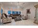 Elegant living room featuring a crystal chandelier and stylish patterned armchairs at 4087 Villa Rafael Dr, Las Vegas, NV 89141