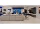 Large living area with modern furniture, entertainment center, and contemporary artwork at 4087 Villa Rafael Dr, Las Vegas, NV 89141