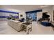 Open-concept living space with a grand piano, stylish decor, and easy access to the kitchen at 4087 Villa Rafael Dr, Las Vegas, NV 89141