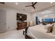 This is a large main bedroom with a ceiling fan and elegant furnishings at 4087 Villa Rafael Dr, Las Vegas, NV 89141