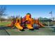 Colorful community playground with multiple slides, climbing structures, and a shaded picnic area at 4087 Villa Rafael Dr, Las Vegas, NV 89141