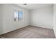 Bright bedroom with large windows, carpet, and neutral walls at 4245 Gold Desert St, North Las Vegas, NV 89032