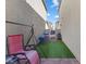 Narrow backyard area featuring artificial grass and a swing at 4371 Fire Glow Ave, North Las Vegas, NV 89084
