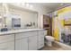 Bathroom features modern fixtures, spacious vanity, and a shower with decorative curtain at 4371 Fire Glow Ave, North Las Vegas, NV 89084