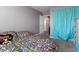 Cozy bedroom features bright decor and natural light from a large window at 4371 Fire Glow Ave, North Las Vegas, NV 89084