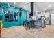 Open dining and living area featuring tile floors and bright accent walls at 4371 Fire Glow Ave, North Las Vegas, NV 89084