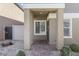 Charming front porch with brick pavers and neutral stucco siding at 4371 Fire Glow Ave, North Las Vegas, NV 89084