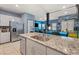 Kitchen with granite countertops, stainless appliances, tile floors, and an open layout at 4371 Fire Glow Ave, North Las Vegas, NV 89084