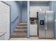 Modern kitchen features stainless steel appliances and convenient access to the staircase at 4371 Fire Glow Ave, North Las Vegas, NV 89084
