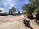 Expansive backyard showcasing shade trees, desert landscaping, and a storage shed at 4485 Greenhill Dr, Las Vegas, NV 89121