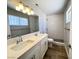 Updated bathroom featuring a double vanity, modern fixtures and a tiled walk-in shower at 4485 Greenhill Dr, Las Vegas, NV 89121