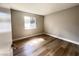 Bright bedroom showcasing wood floors, natural light, and neutral paint, creating a cozy atmosphere at 4485 Greenhill Dr, Las Vegas, NV 89121
