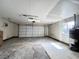 Spacious garage with a functional overhead door, work space, and utility connections at 4485 Greenhill Dr, Las Vegas, NV 89121
