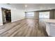 Bright and airy living room featuring light wood floors, recessed lighting and sliding glass doors at 4485 Greenhill Dr, Las Vegas, NV 89121