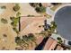 Birds eye view of a single Gathering home with mature trees, desert landscaping and a tile roof at 4963 Pensier St, Las Vegas, NV 89135